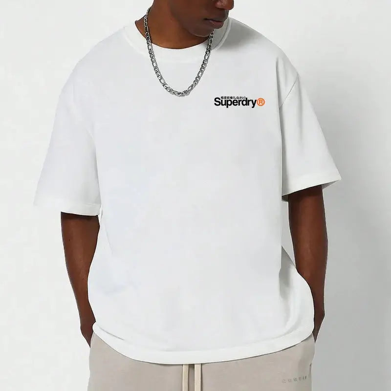 Man wearing a Superdry vintage t-shirt in white, featuring the Superdry logo on the chest and relaxed fit design.