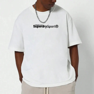 Superdry vintage t-shirt displayed on a model wearing a white oversized tee with a classic logo.